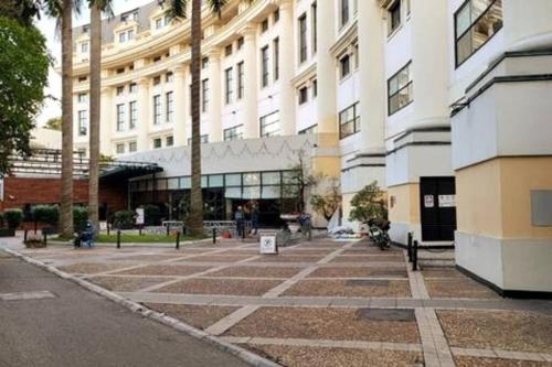 an empty parking lot in front of a building at High-class French villa 168m2 by SSens Homes in Hanoi