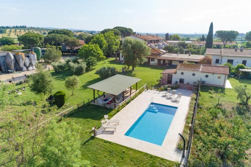 an aerial view of a house with a swimming pool at Agriturismo Al Girasole in San Donato