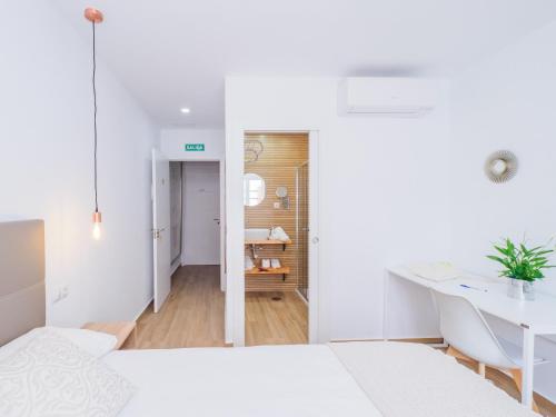Ένα ή περισσότερα κρεβάτια σε δωμάτιο στο Cubo's Hostal William's Sunny 4 with Breakfast