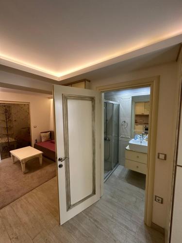 an open door to a room with a bathroom at Sea Wave House in Hanioti