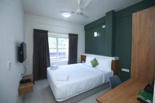 Postel nebo postele na pokoji v ubytování Hotel Royal Blooms