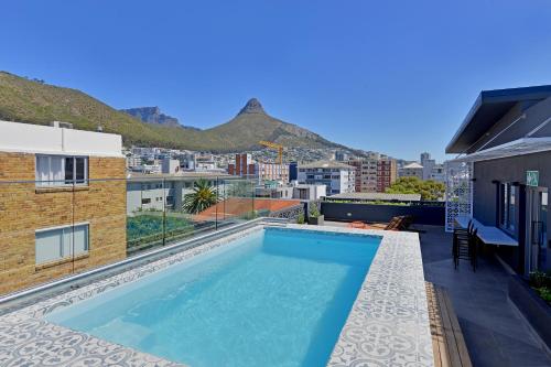 a swimming pool on the roof of a building at SixOnN Luxury Apartments by Elevate in Cape Town