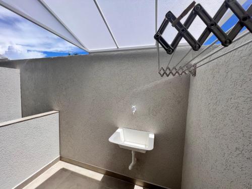 a bathroom with a urinal on the wall at VilaMar Jacuípe in Camaçari