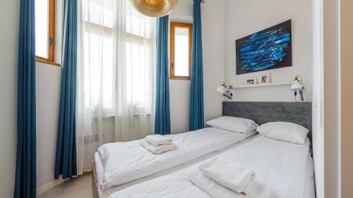 Posteľ alebo postele v izbe v ubytovaní Apartamenty Sun & Snow Traugutta Plaża