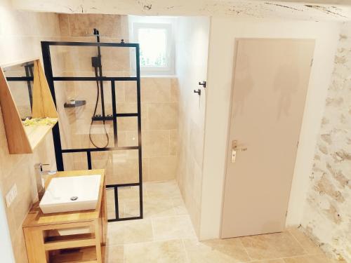 a bathroom with a sink and a shower at Bastide Provençale Les Mûriers d'Engaspaty in Seillans