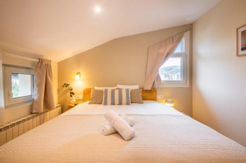 Katil atau katil-katil dalam bilik di Hotel Donosti