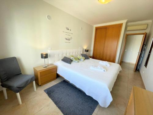 Giường trong phòng chung tại Apartamento Palmeiras