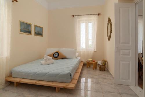 a bedroom with a bed with a wooden bed frame at Theros Home Andros in Andros