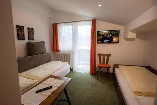 Jugend- und Familienhotel Venedigerhofにあるベッド