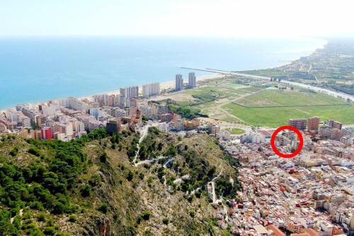 a view of a city with a red circle at Comfy Apartment With a Castle View in Cullera