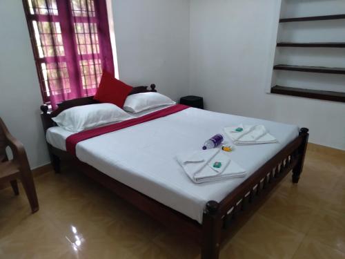 Ένα ή περισσότερα κρεβάτια σε δωμάτιο στο Homely Homestay