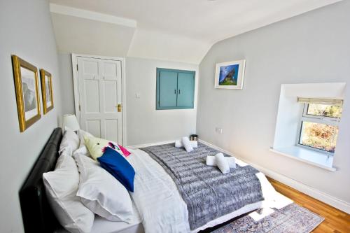 a bedroom with a bed and a window at Atlantic Way Cottage in Galway