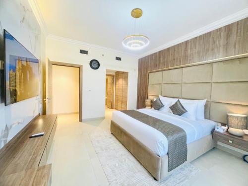 Кровать или кровати в номере GOODWOOD SUITES HOMES VACATION