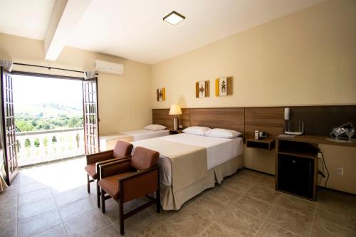 Katil atau katil-katil dalam bilik di Hotel Dona Paschoalina