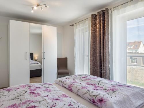 Un pat sau paturi într-o cameră la Amsel - Vogelhaus