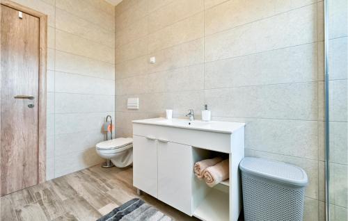 a bathroom with a sink and a toilet at Beautiful Home In Stubicke Toplice in Stubicke Toplice