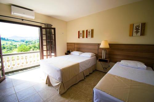 Katil atau katil-katil dalam bilik di Hotel Dona Paschoalina
