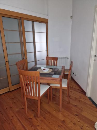 a dining room with a table and two chairs at Relax al Mare in Viareggio