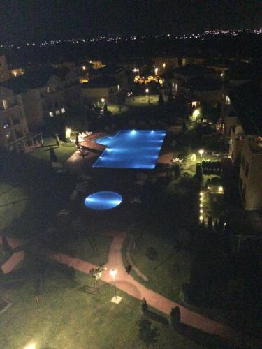 a large swimming pool at night with lights at Lucas investment L3 -104 in Creţuleasca