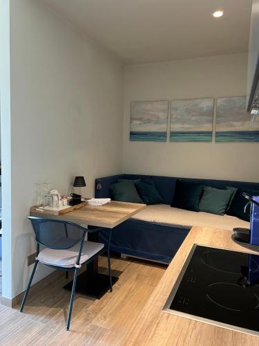 a room with a bed and a table and a couch at GreenValley BnB in Lapedona