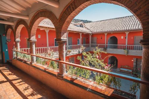 a view from the balcony of a building with arches at Tambo del Arriero Hotel Boutique in Cusco
