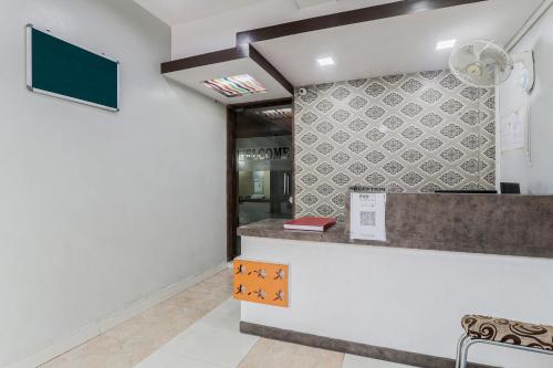 a lobby of a hospital with a sign on the wall at OYO Flagship Hotel Jagbamda in Jamshedpur