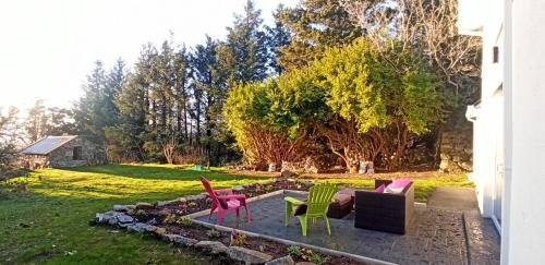 a group of chairs sitting on a patio at Atlantic Way Cottage in Galway