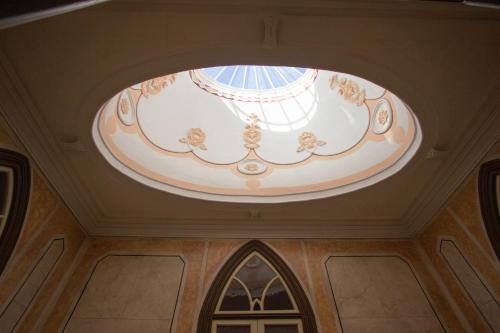 a domed ceiling with a ceiling light in a building at Dom José Alojamentos by Guestify in Guimarães