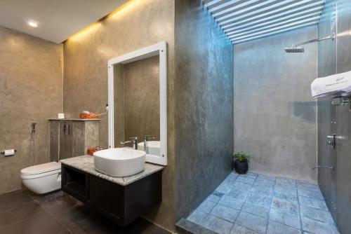 a bathroom with a sink and a toilet at Green Acres Leisure Resort & Spa in Kandy