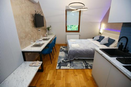 Postel nebo postele na pokoji v ubytování ETA APARTMENT