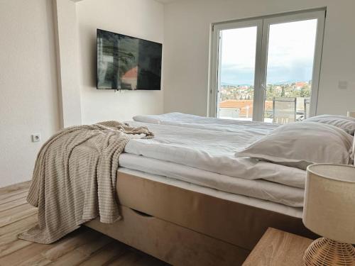 Uma cama ou camas num quarto em Apartment ”Sand” on island Šolta