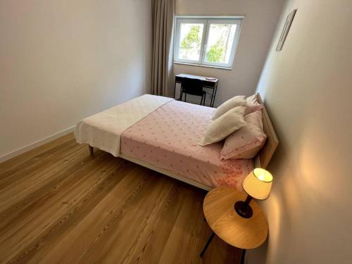 Postel nebo postele na pokoji v ubytování Apartamento Carlos Seixas