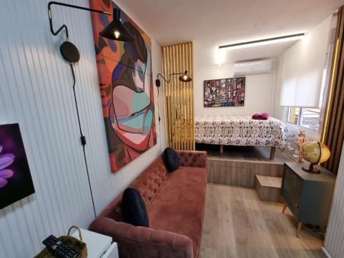 a living room with a couch and a bedroom at Estudio Brisa del Poniente Aguadulce in Aguadulce