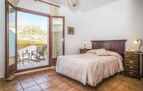 a bedroom with a bed and a balcony at 5 bedrooms villa with private pool furnished terrace and wifi at Priego de Cordoba in Priego de Córdoba