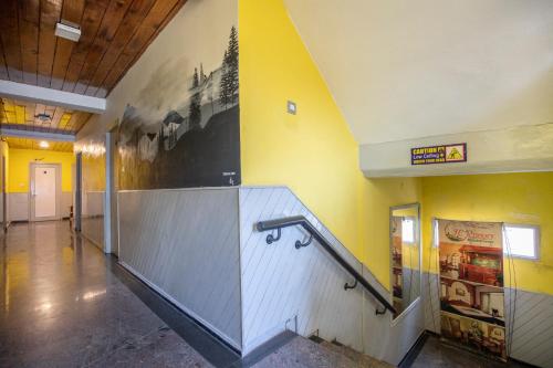an empty hallway with a staircase in a building at JC Woodville Manor in Kodaikānāl