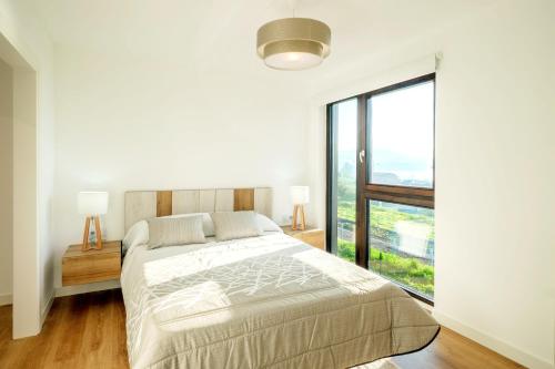 Posteľ alebo postele v izbe v ubytovaní Charming House Sea View in Outes