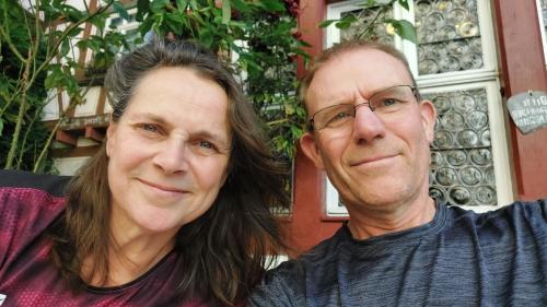 a man and a woman posing for a picture at Holiday Home Achterbos in Sint-Oedenrode