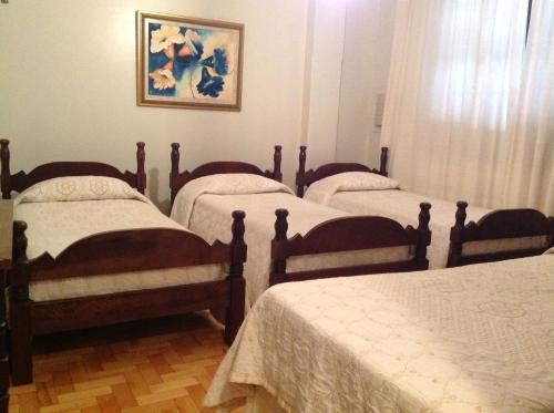 Ένα ή περισσότερα κρεβάτια σε δωμάτιο στο Hotel São Luiz