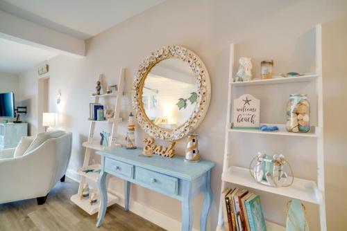 a room with a blue dressing table and a mirror at Beachfront Condo with 3 Pools on St Helena Island! in Oceanmarsh Subdivision
