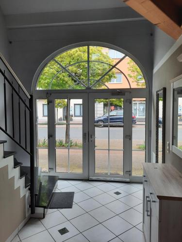 an open entry way to a house with a glass door at Wohnung in Bad Lippspringe in Bad Lippspringe