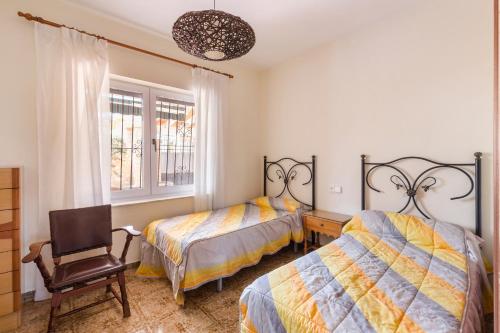 Postel nebo postele na pokoji v ubytování Villa el Carmoli