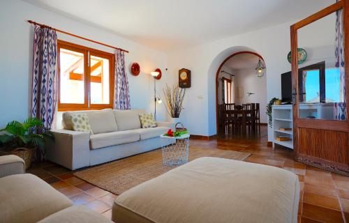 a living room with a couch and a table at Quality Villa Sa Tapia in Porreres