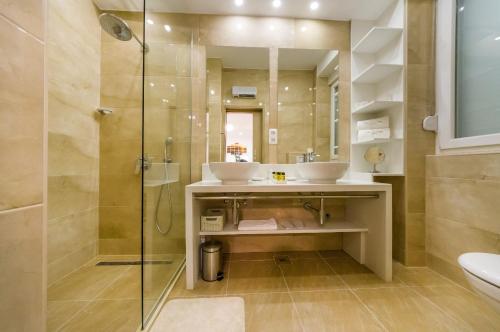 a bathroom with two sinks and a shower at Peninsula Luxury Suite in Zadar