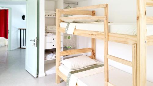 a room with bunk beds in a hostel at 4 bedrooms villa with private pool enclosed garden and wifi at Mahebourg 1 km away from the beach in Mahébourg