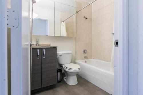 a bathroom with a toilet and a tub and a sink at 3 BR with Splendid River views in New York