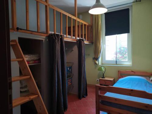 Postel nebo postele na pokoji v ubytování Appartement spacieux avec grand patio, 1er étage