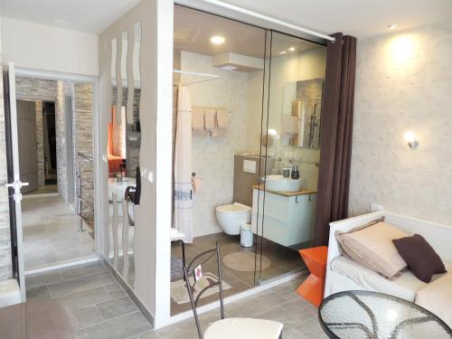 a bathroom with a shower and a toilet in a room at Welcoming Villa in Vantačići with Pool and Sea View in Vantačići