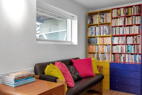 a living room with a couch with colorful pillows at SK52 by the Sea, Unique spacious luxury, HG-17071 in Reykjavík
