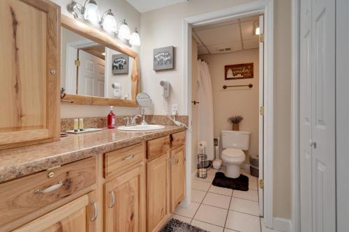 a bathroom with a sink and a toilet at Gatlinburg Condo with Mountain Views and Pool Access in Gatlinburg