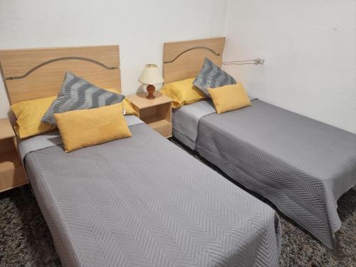 Ένα ή περισσότερα κρεβάτια σε δωμάτιο στο Apartamento puerto